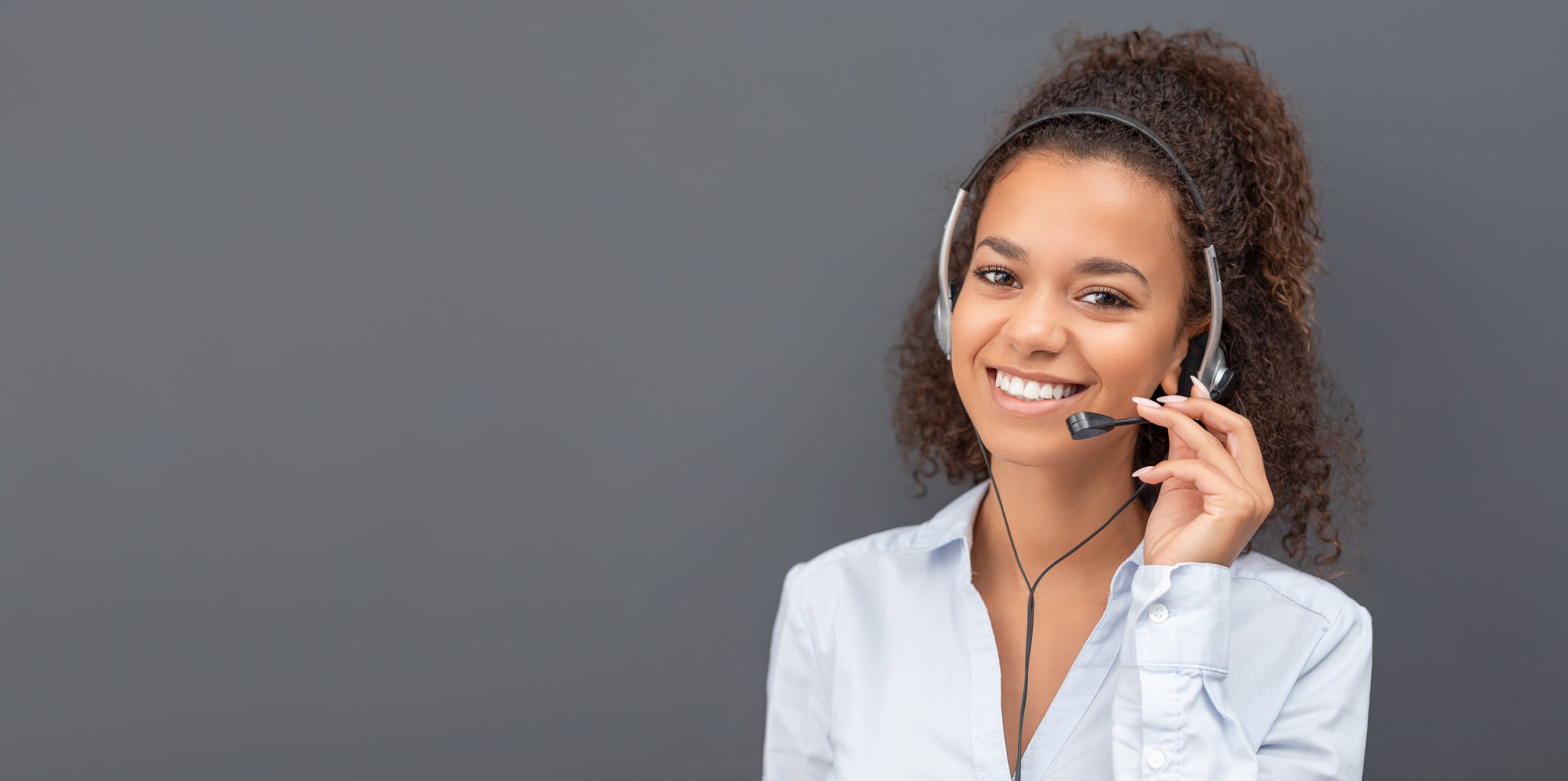 Call Center Employee Isolated on a Gray Background