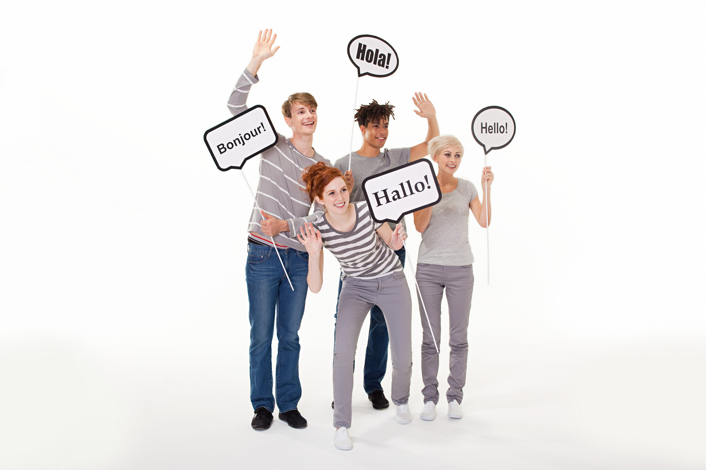 People holding signs that say hello in different languages